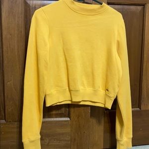 yellow crewneck sweatshirt